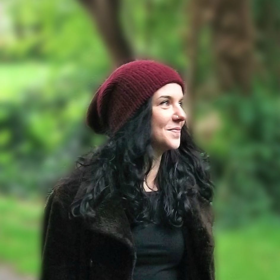 Lel wearing one of her handmade beanie hats in Scotland