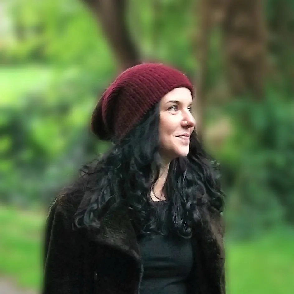 Lel wearing one of her handmade beanie hats in Scotland
